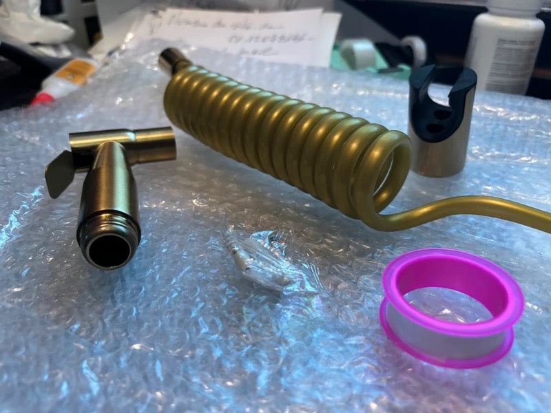 Douchette dorée en acier